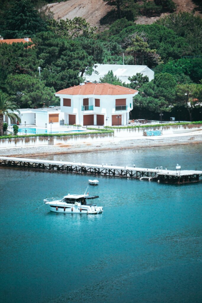 Aerial view of a waterfront home and its private dock
