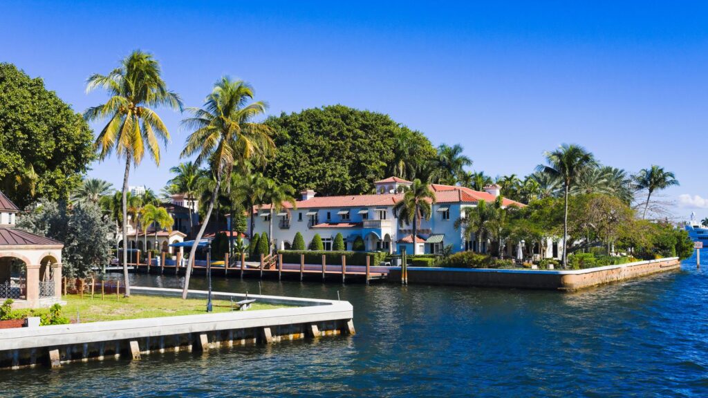 Palm-lined waterfront homes along a residential canal