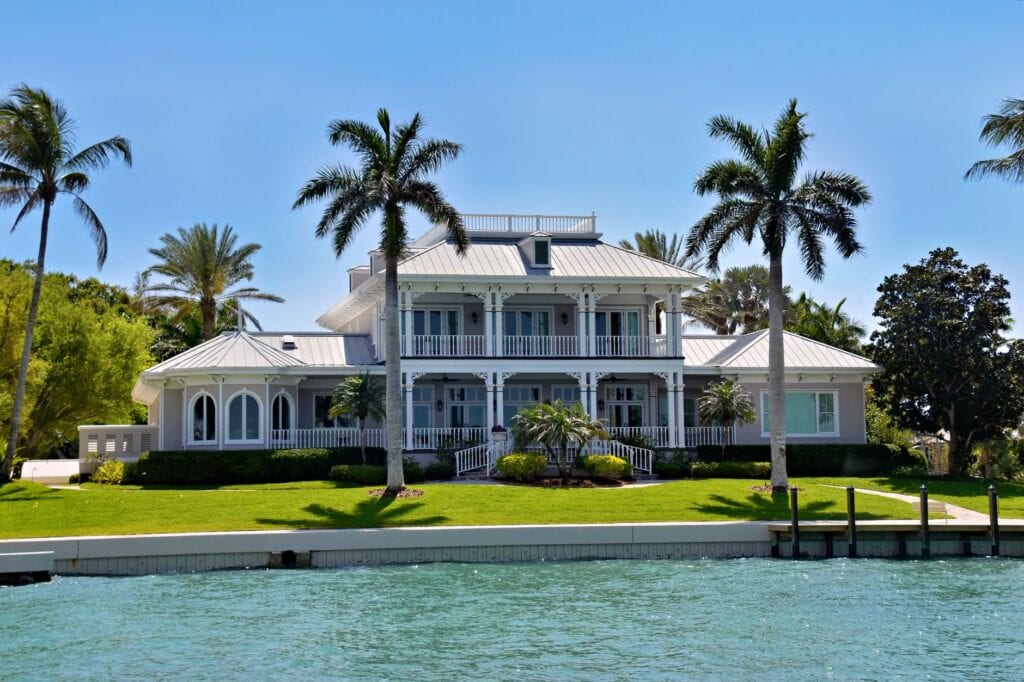 Lawn, seawall and private dock at a waterfront residence