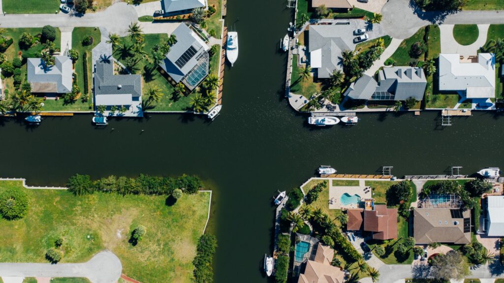 Aerial view of canal-front homes with private docks