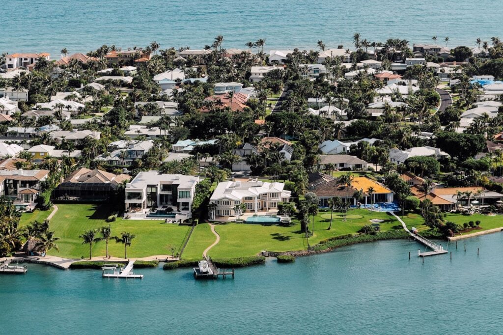 Aerial view of luxury waterfront homes on a protected point