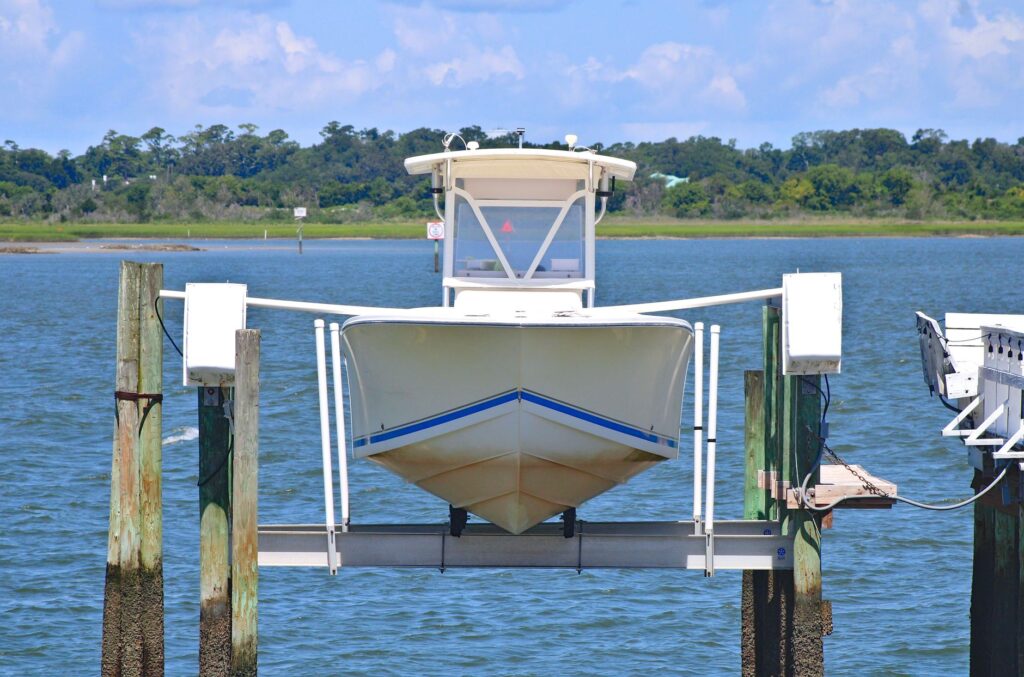 Boat held above the waterline on a four-post dock lift
